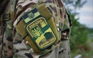 В Киеве сторонники коммунистов набросились на ветерана АТО возле Вечного огня